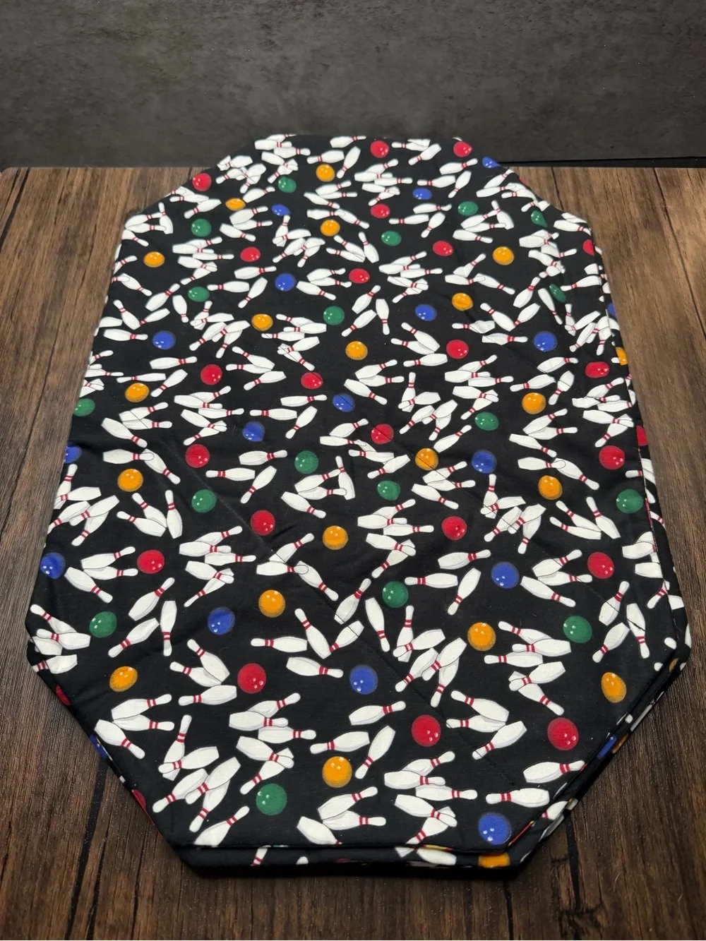 set of 4 handmade double sided placemats features a bowling theme 19”x13”